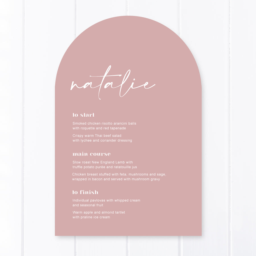 Modern arch shaped wedding menus printed in Australia, white printing on dusty pink card with guest names on each menu.