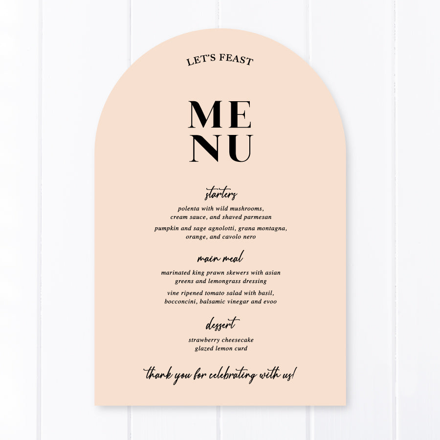 Modern arch wedding menu designed and printed in Australia with calligraphy font. Nude pink cardstock with Lets Feast for heading.