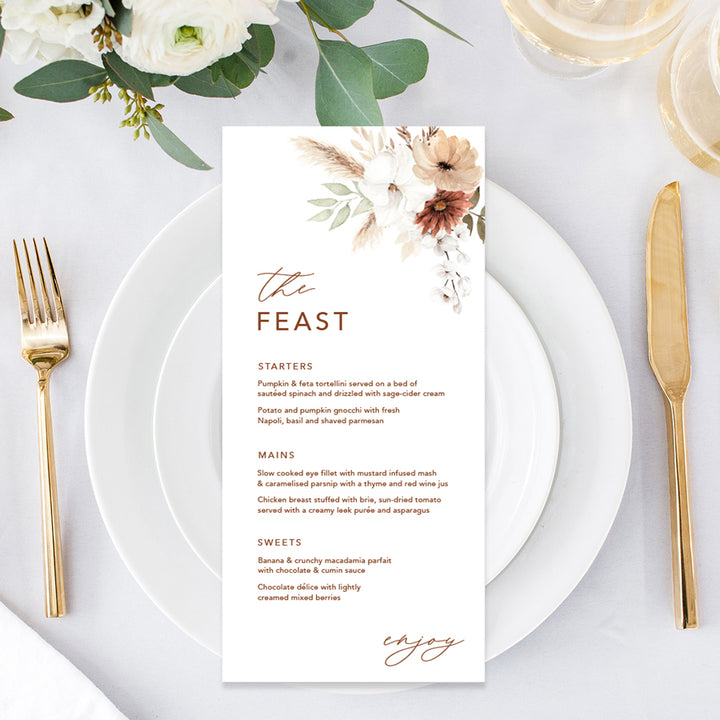 Bohemian floral wedding menu with soft terracotta colours and greenery, pampas grass. The feast heading. Peach Perfect Australia.
