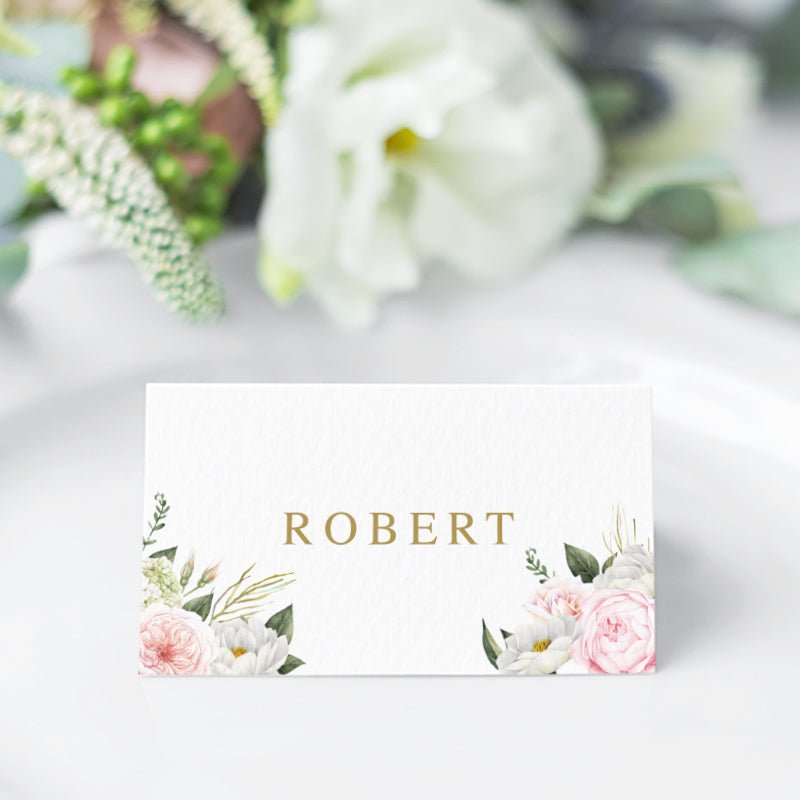 Folded or Flat wedding place cards with soft pink and apricot florals in corners and modern font in gold