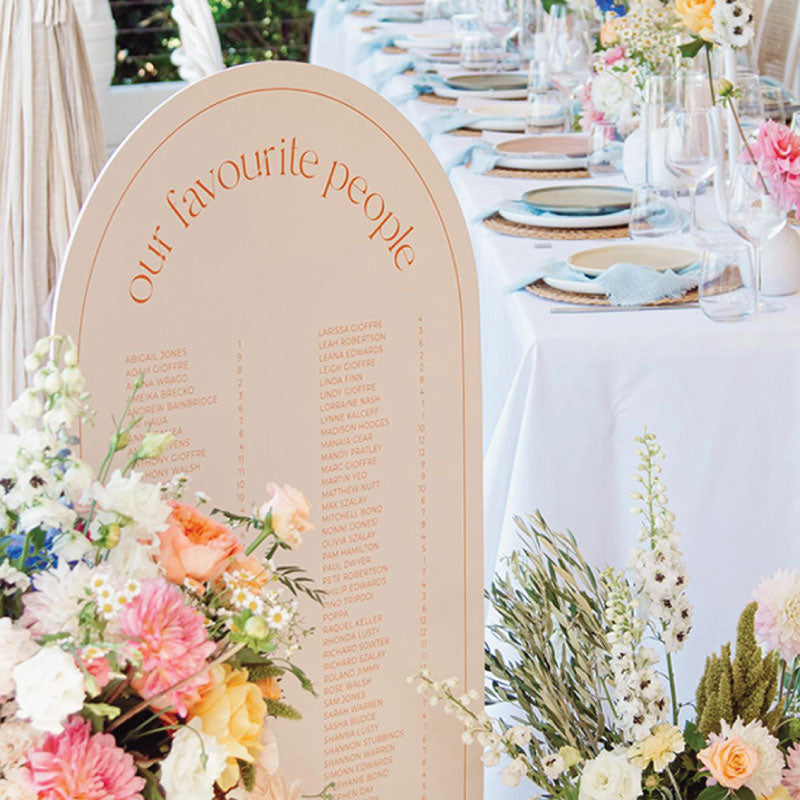 Peach arch shape wedding seating chart with our favourite people heading
