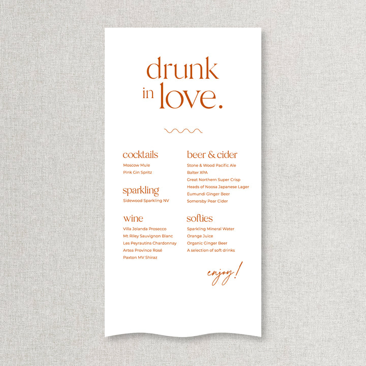 Modern wedding bar sign in burnt orange and white printed on linen or satin. Drunk in Love heading.