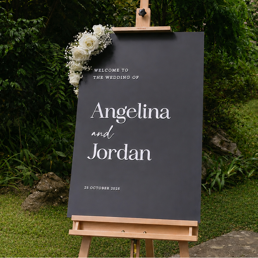 Modern wedding welcome sign with raised lettering on matt acrylic in black and white