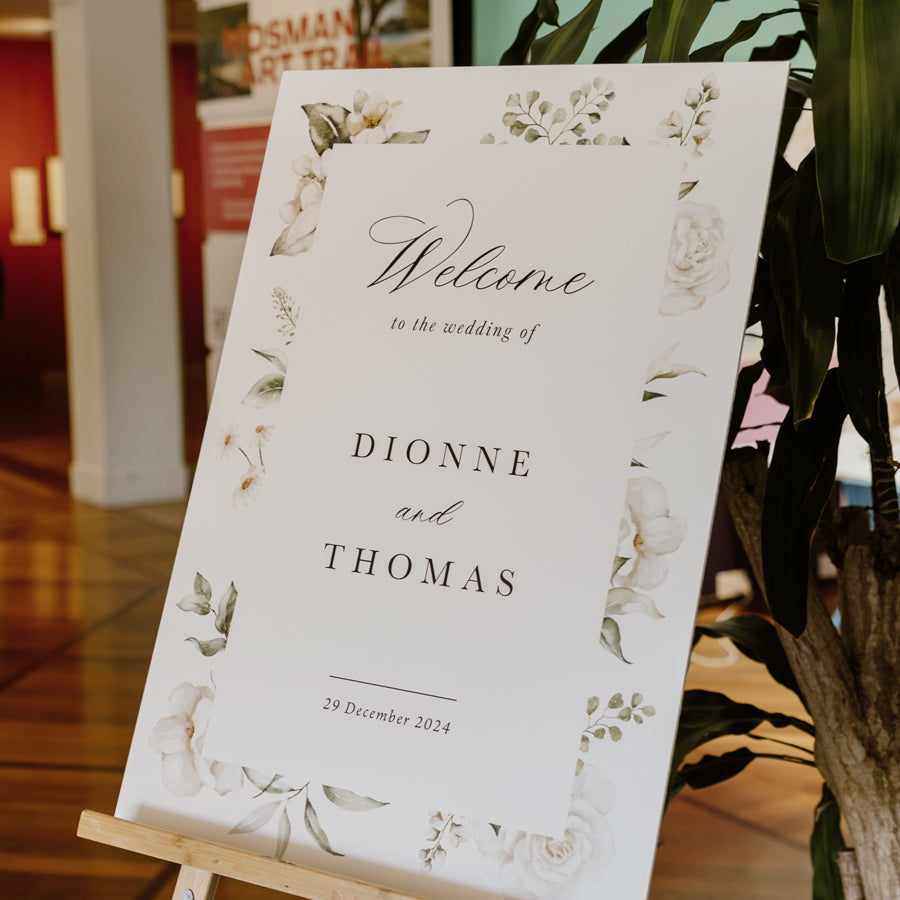 White floral wedding welcome sign with calligraphy and old world style