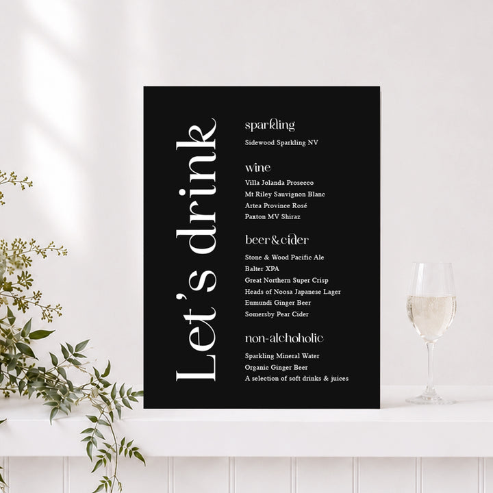 Modern wedding bar sign with black background and Lets Drink heading with list of wedding drinks. Printed in Australia.