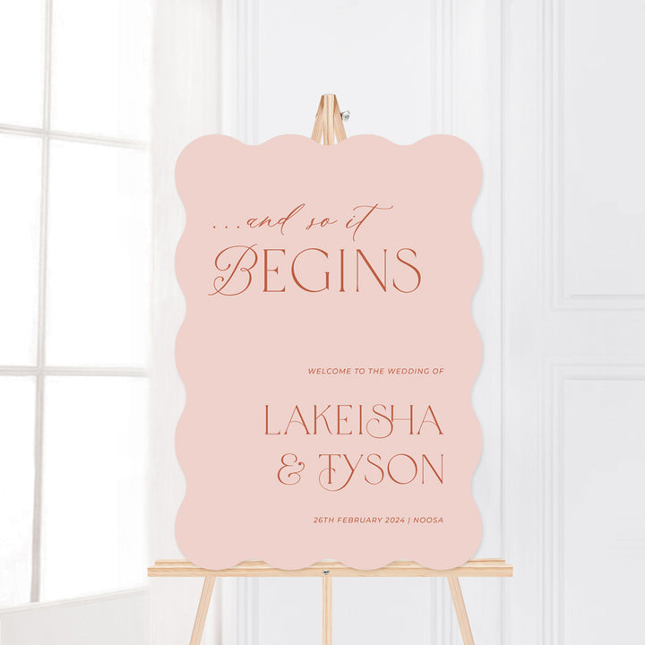 Wedding welcome sign. And so it begins. Blush pink and terracotta clay colour printed on signage board or acrylic Australia.