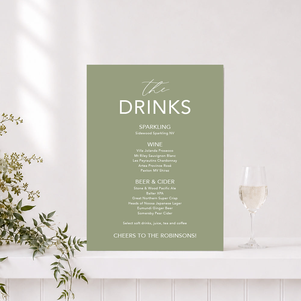 Wedding drinks sign in green and white with "The Drinks" heading and list of alcoholic drinks, printed on foamboard or acrylic in Australia.