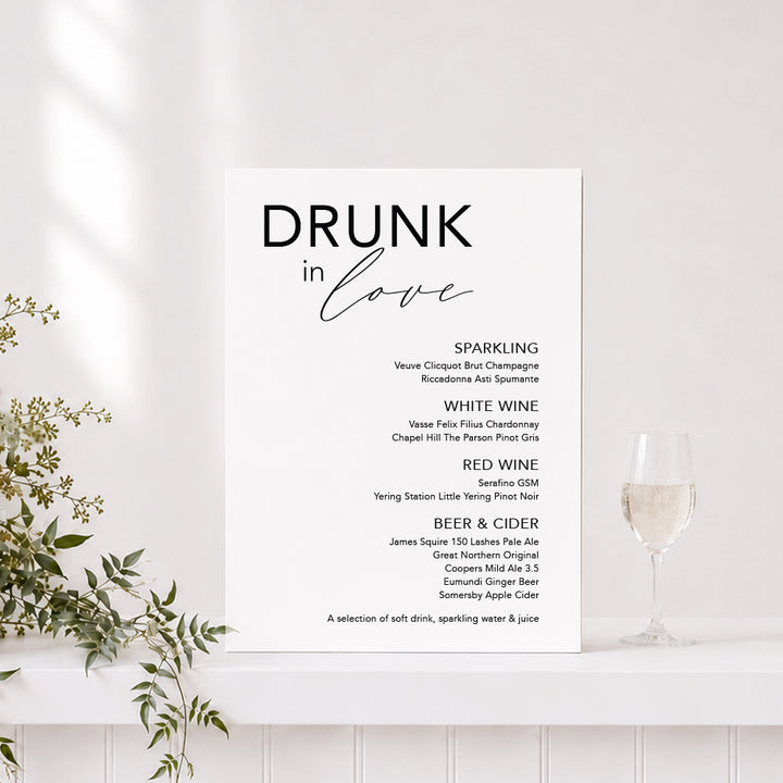 Wedding drinks sign in black and white with "Drunk in Love" heading and list of alcoholic drinks, printed on foamboard or acrylic in Australia.