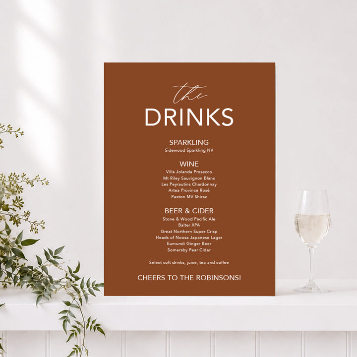 Wedding drinks sign in terracotta and white with "The Drinks" heading and list of alcoholic drinks, printed on foamboard or acrylic in Australia.