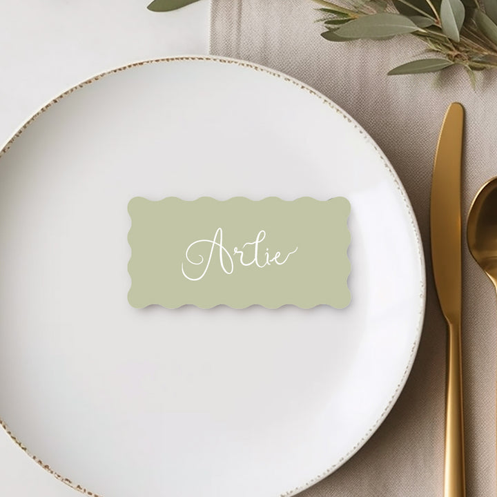 Wave wiggle shape wedding place card or name cards with hand written script font in green and white. Peach Perfect Australia.