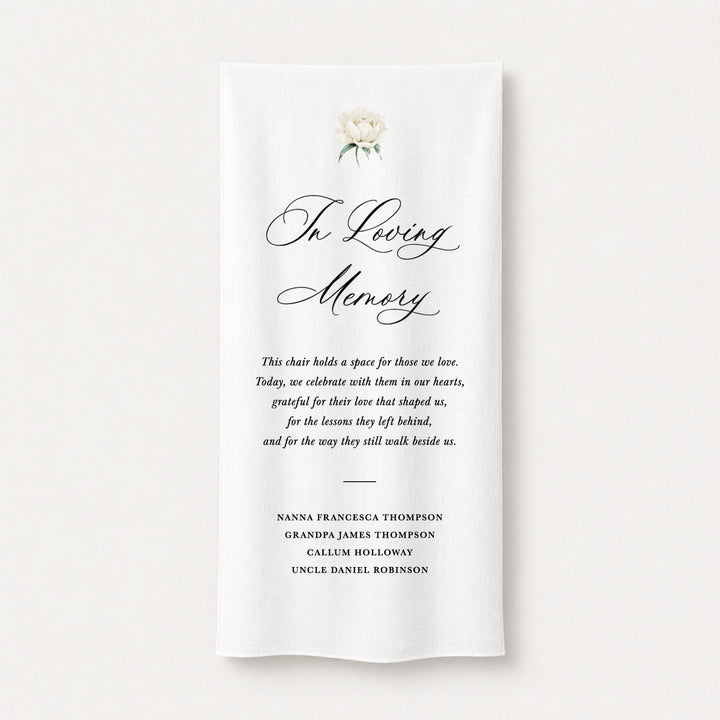 A white fabric memorial linen banner featuring elegant black script text reading &