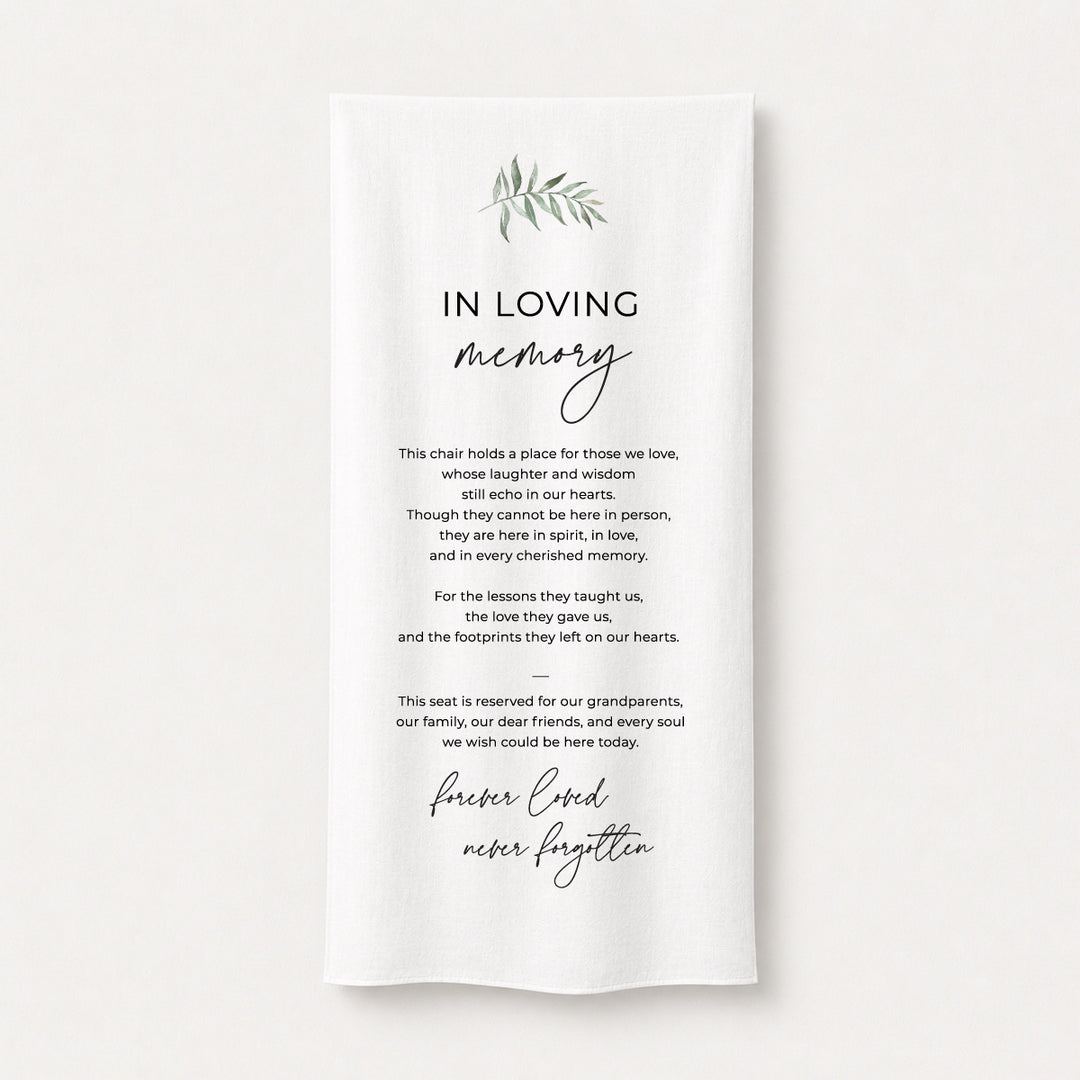 A white draped fabric memorial banner or fabric sign with elegant black text reading &