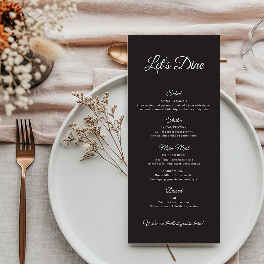 Black and white wedding menu with let's dine heading and modern calligraphy.  Printed in Australia by Peach Perfect.