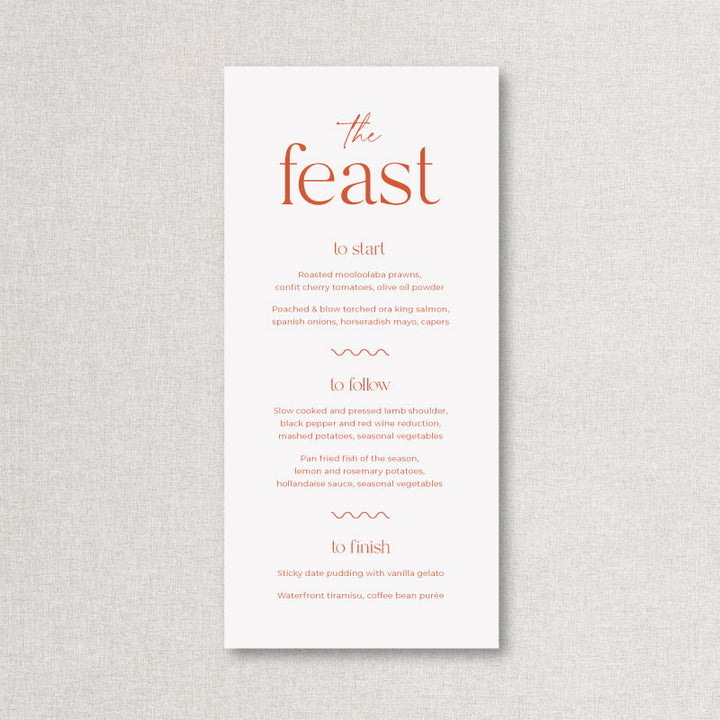 Orange and white wedding menu with the Feast heading.