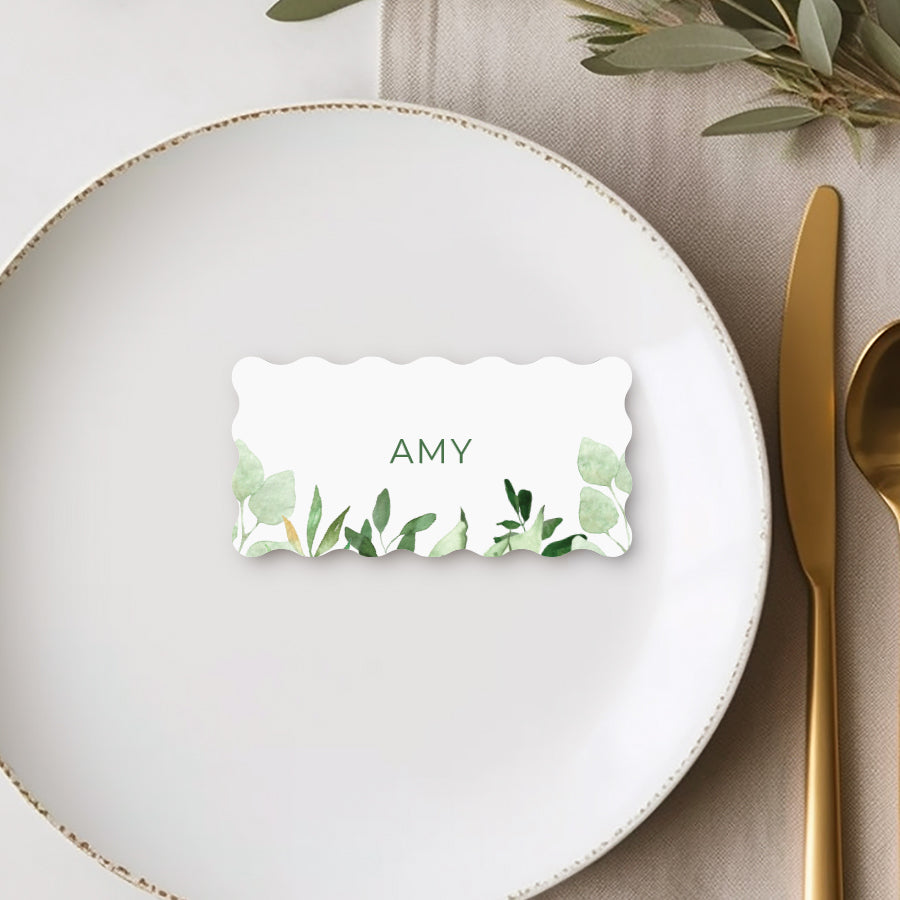 Flat wavy or wiggle shape wedding place cards or name cards with green leaves. Peach Perfect Australia.