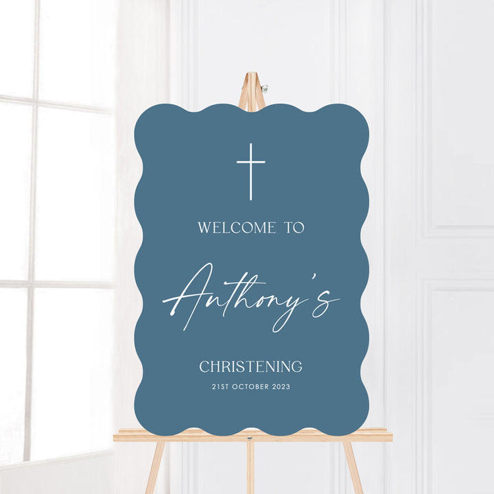 Boy Baptism or Christening wave or wiggle shape welcome signboard in blue with white text. Modern style by Peach Perfect Australia.