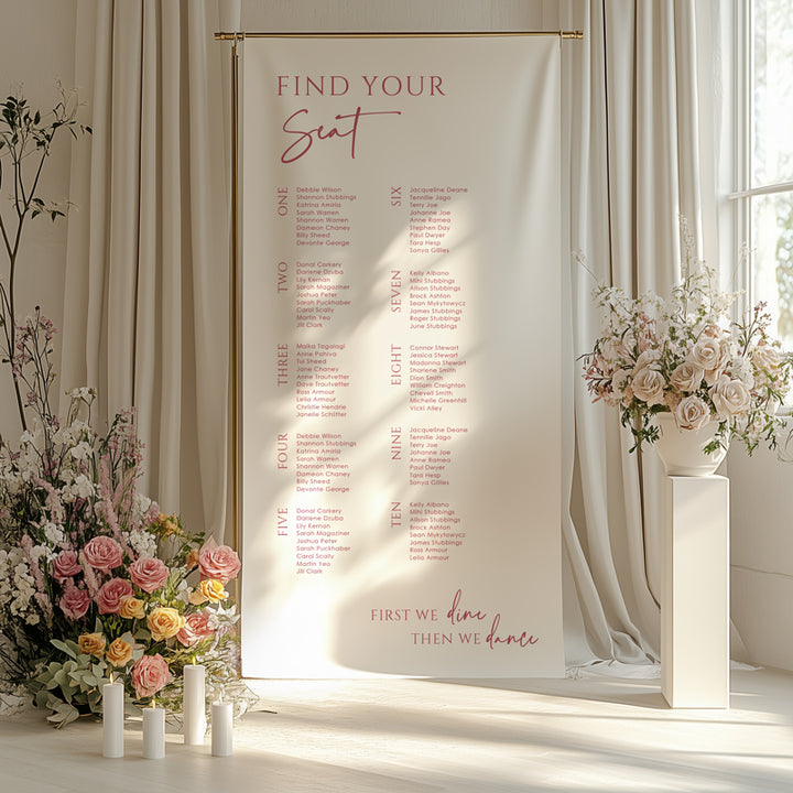 Modern wedding seating chart printed on linen fabric in pink and white with first we dance then we dine heading.