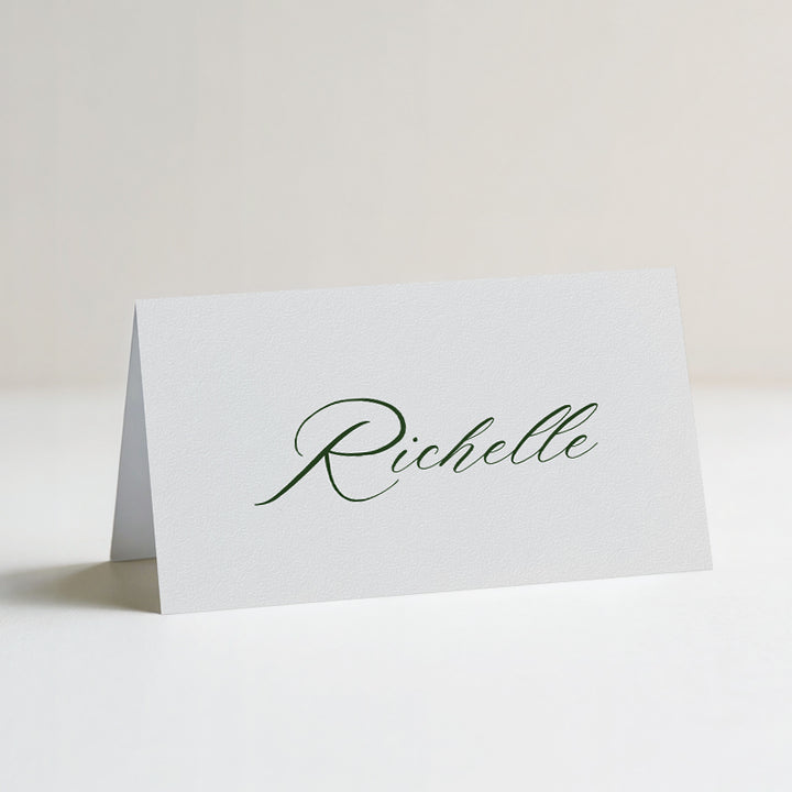 Folded wedding place cards or name cards with romantic calligraphy font in green and white. Printed in Australia.