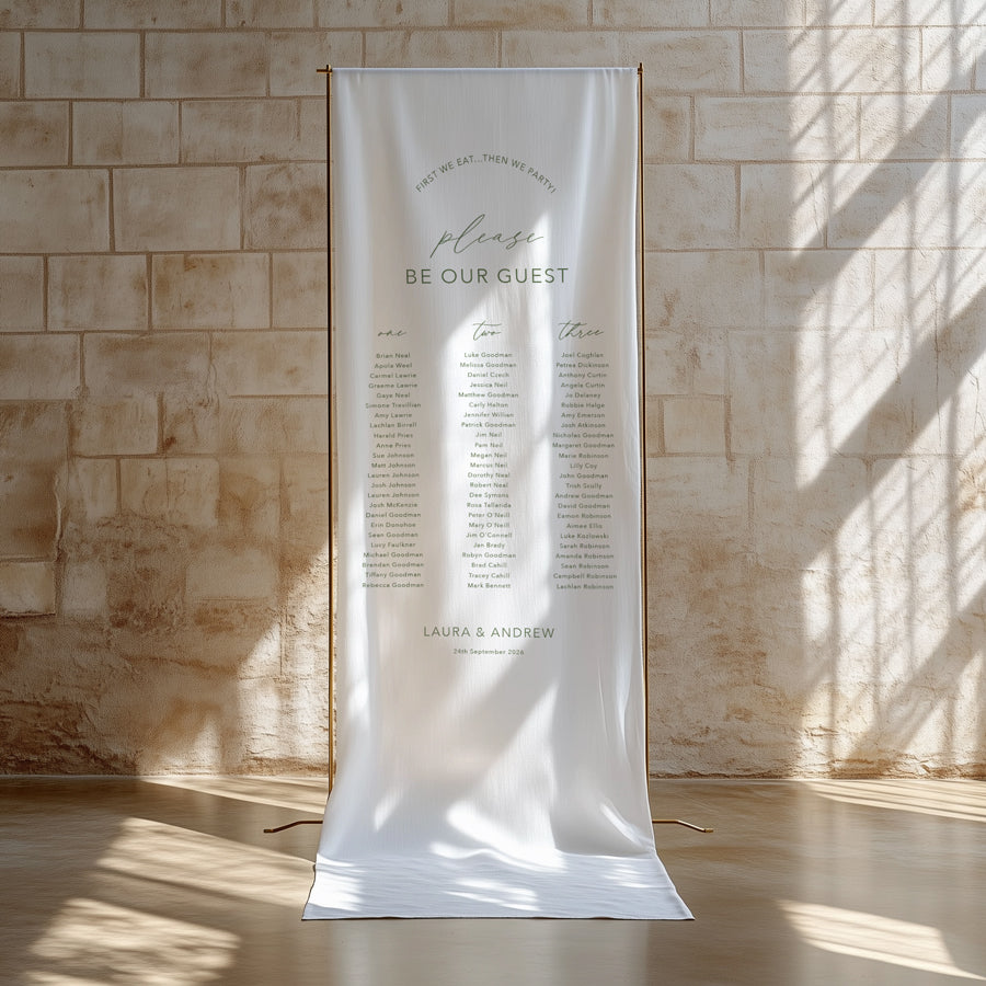 Wedding seating chart printed on linen fabric in green and white.