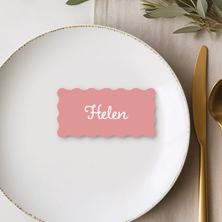 Wave shape wedding place card printed in Australia on premium pink cardstock.