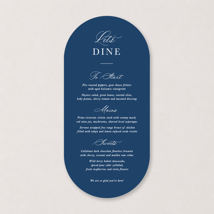 Navy blue wedding menu with elegant white calligraphy and curved die-cut shape