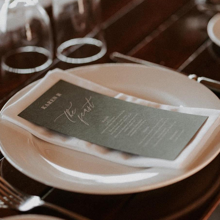 wedding menu white ink on green cardstock with guest names printed on each