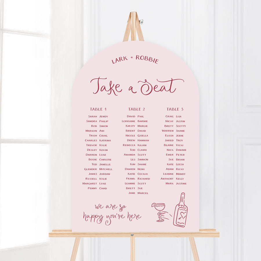 Whimsical wedding seating chart with hand drawn illustrated design elements in pale pink. Peach Perfect Australia.