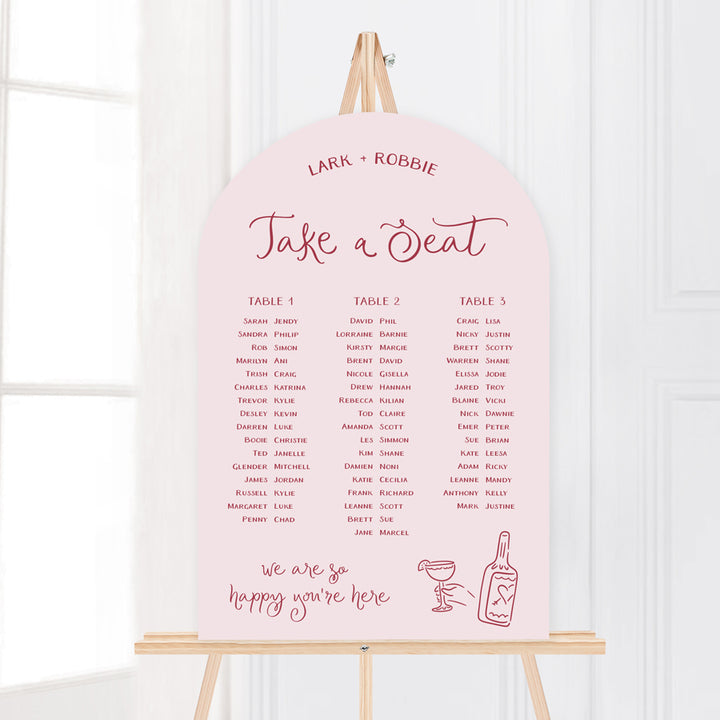 Whimsical wedding seating chart with hand drawn illustrated design elements in pale pink. Peach Perfect Australia.