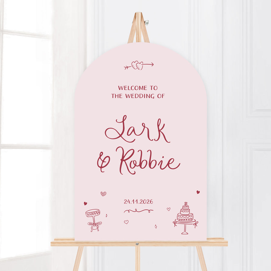 Whimsical wedding welcome sign with hand drawn illustrated design elements in pale pink. Peach Perfect Australia.