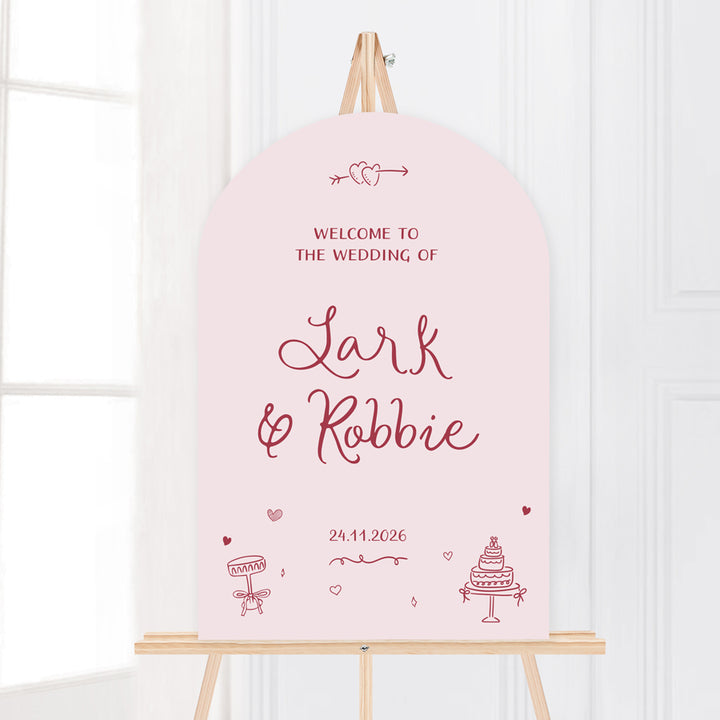 Whimsical wedding welcome sign with hand drawn illustrated design elements in pale pink. Peach Perfect Australia.