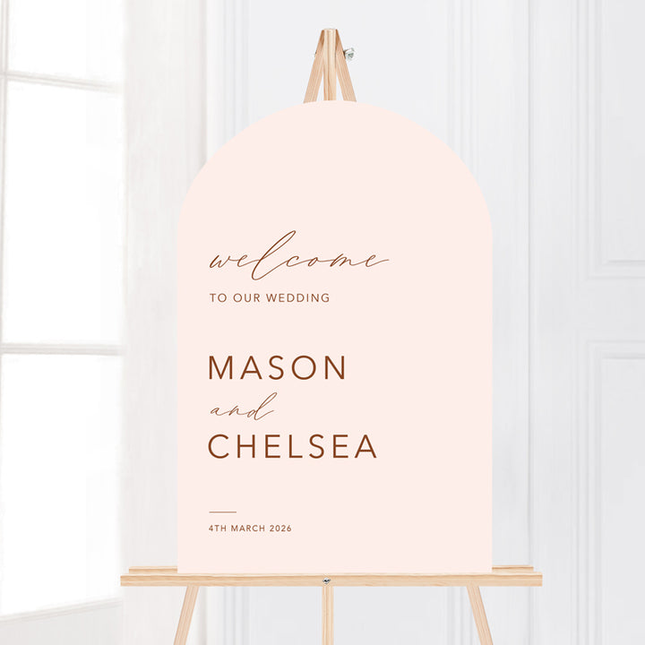 Bohemian arch wedding welcome sign in blush soft pink and terracotta. Printed in Australia on smooth board for sitting on an easel.