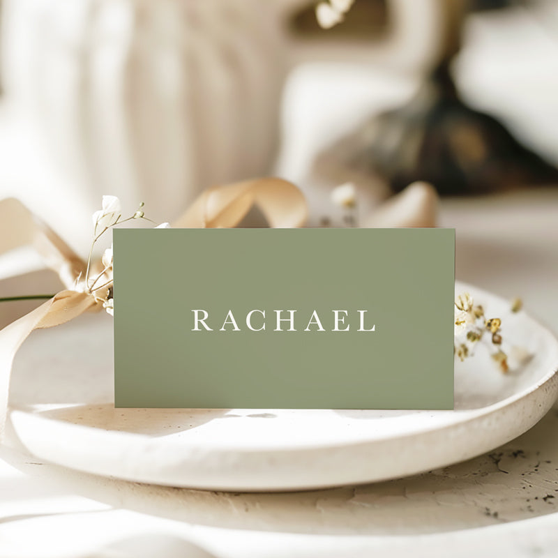 Folded wedding place cards or name cards with readable font. White ink on green card. Printed in Australia.