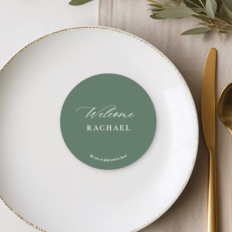 Die cut round wedding place cards or name cards with calligraphy font and personalised message to guests. White ink on green card.