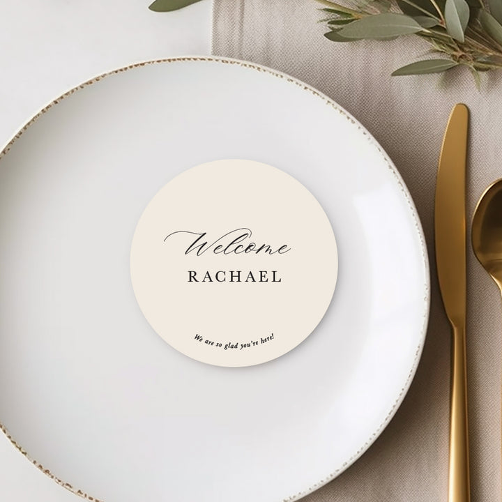 Die cut cream round wedding place cards or name cards with calligraphy font and personalised message to guests.