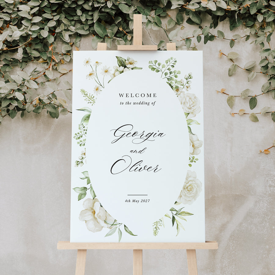 Wedding welcome sign printed in Australia with white flowers, leafy border and calligraphy. Peach Perfect.