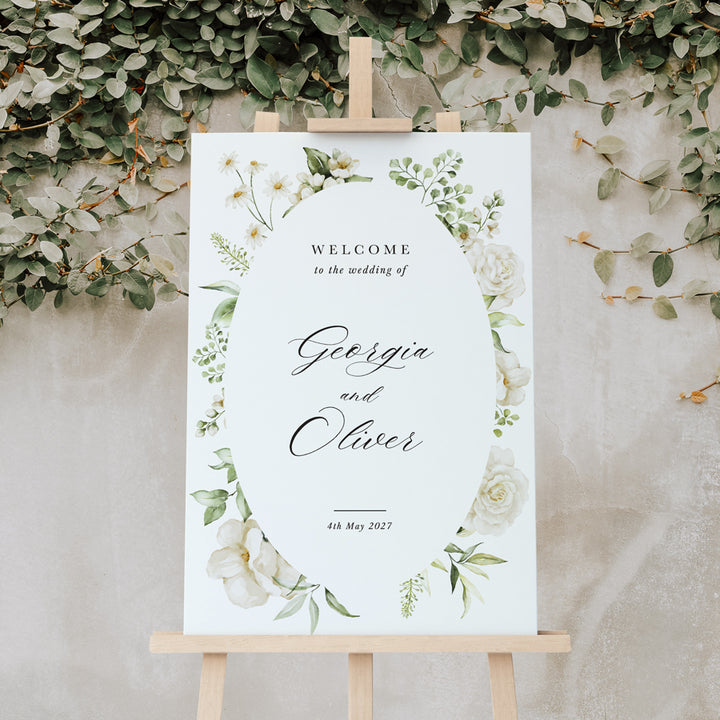 Wedding welcome sign printed in Australia with white flowers, leafy border and calligraphy. Peach Perfect.