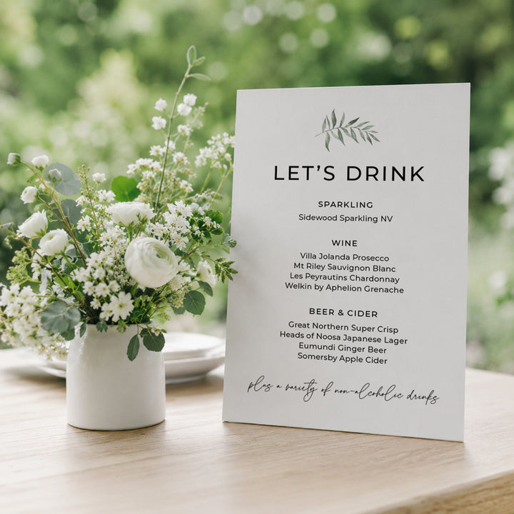 Beautiful nature inspired wedding menu with watercolour painted leaf