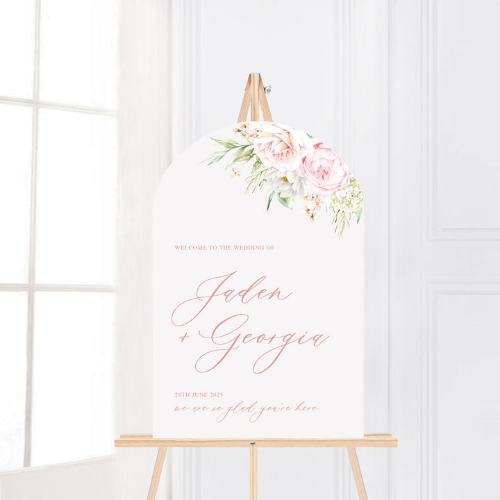 Pink floral arch wedding welcome sign with calligraphy text. Printed in Australia