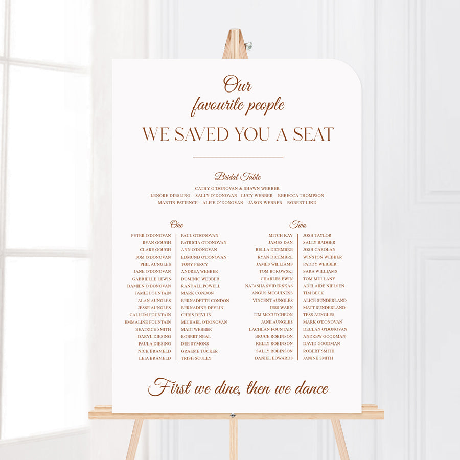 Timeless calligraphy wedding seating chart with we saved you a seat heading, printed in Australia.