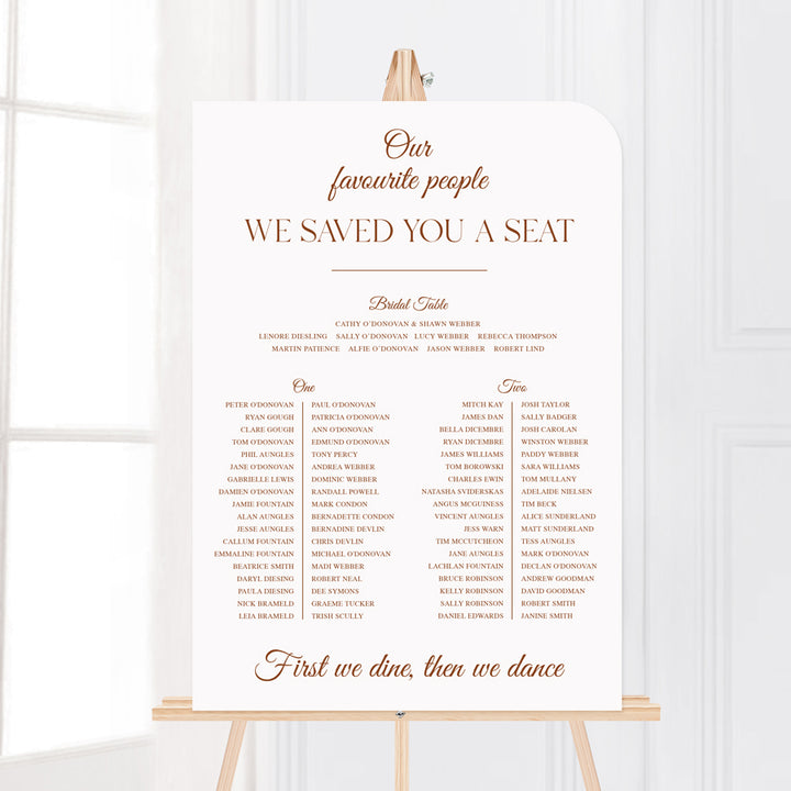Timeless calligraphy wedding seating chart with we saved you a seat heading, printed in Australia.