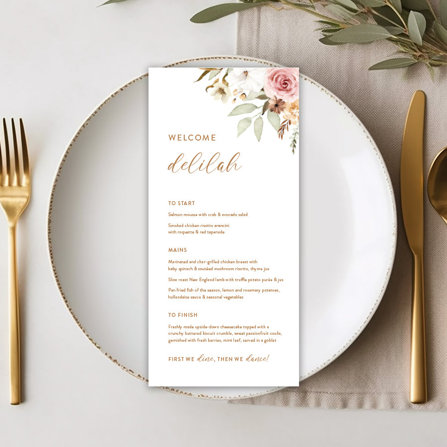 Rustic wedding menu with neutral florals and calligraphy font. Guest names on each menu.