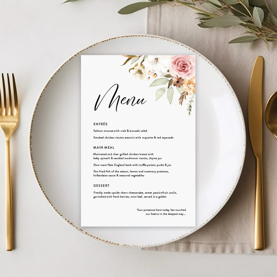 Rustic wedding menu with neutral florals and calligraphy font. Guest names on each menu.