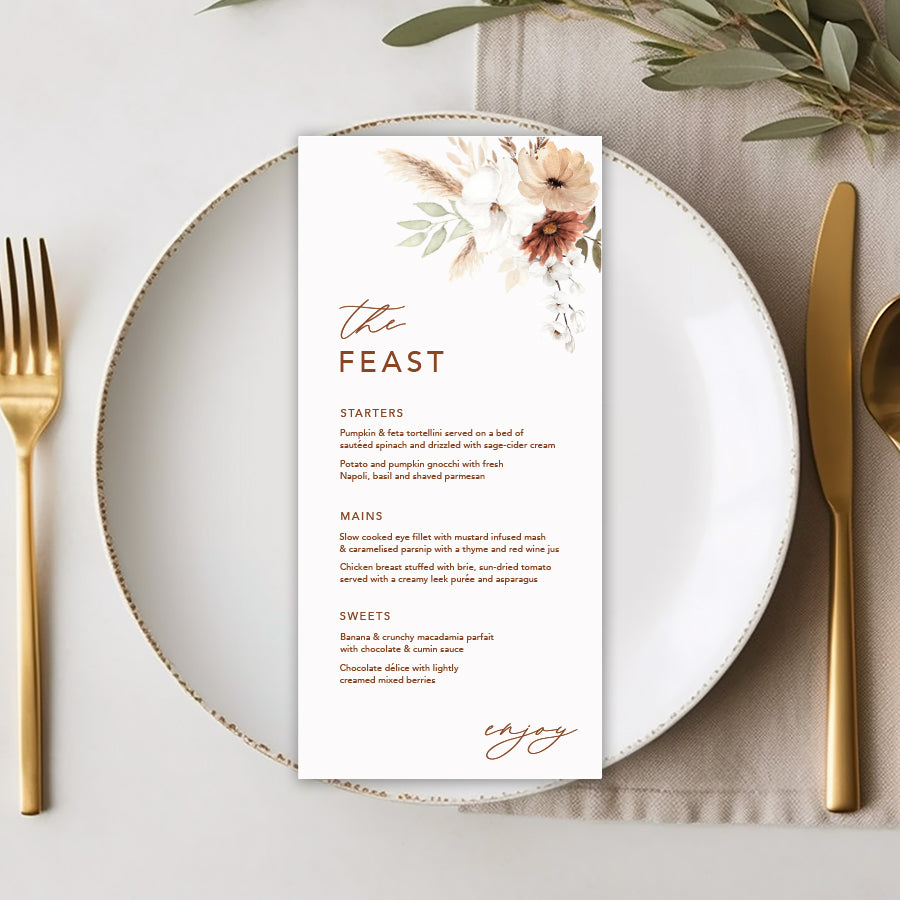 Bohemian floral wedding menu with soft terracotta colours and greenery, pampas grass. The feast heading. Peach Perfect Australia.