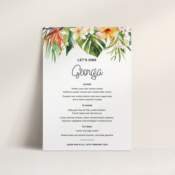 Tropical wedding or event menu with watercolour leaves and flowers and guest names printing. Peach Perfect Australia.
