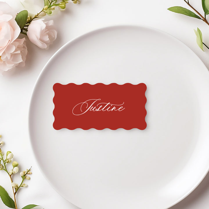 Wavy shape wedding place cards with calligraphy font in bright red and white. Designed and printed in Australia.