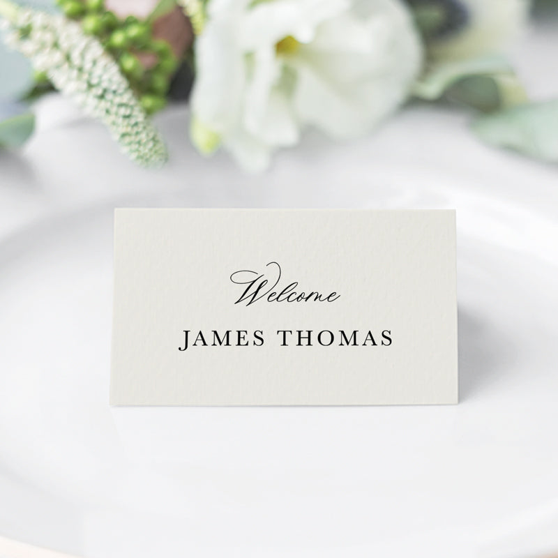 Folded wedding place cards with calligraphy font in neutral almond and black. Designed and printed in Australia.