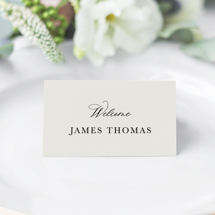 Folded wedding place cards with calligraphy font in neutral almond and black. Designed and printed in Australia.