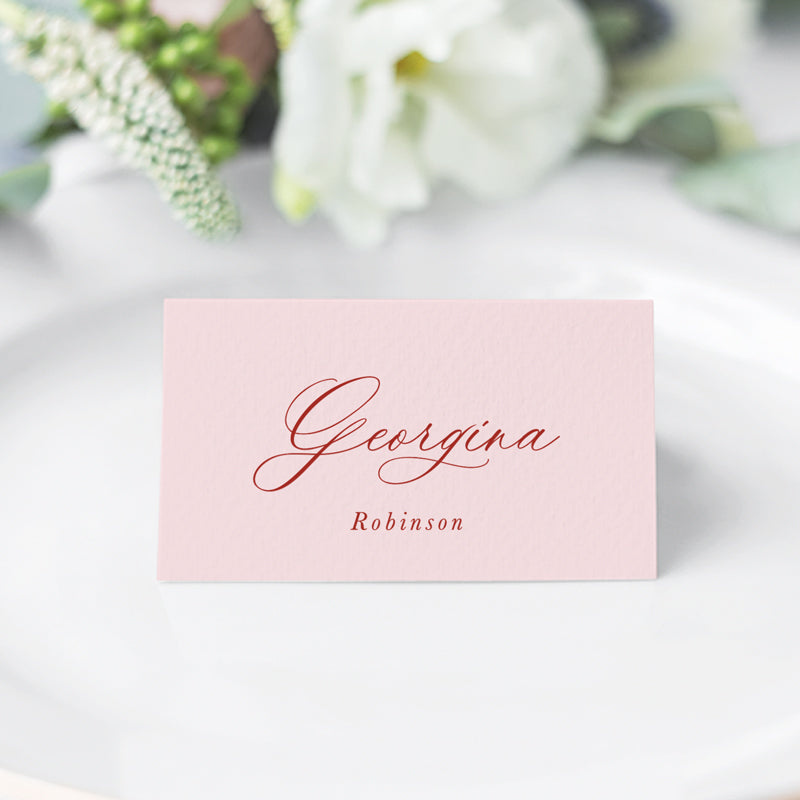 Folded traditional wedding place cards with calligraphy font in pink and red. Designed and printed in Australia.