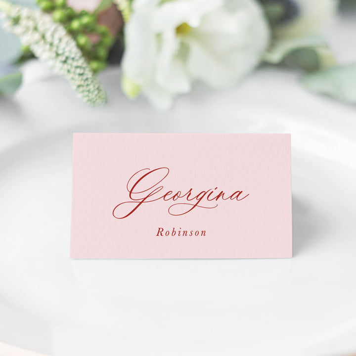 Folded traditional wedding place cards with calligraphy font in pink and red. Designed and printed in Australia.