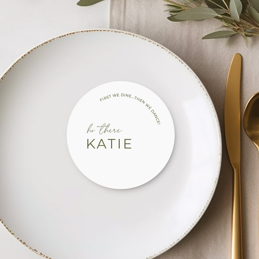 Round die cut coaster style wedding and event place cards with hi there and guest name in green and white.